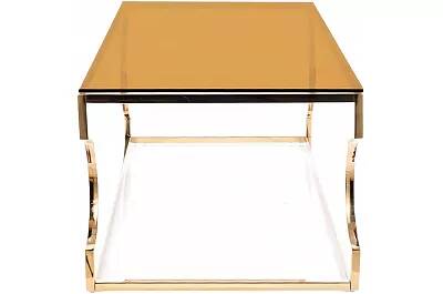 Table basse design en verre ambre et acier doré